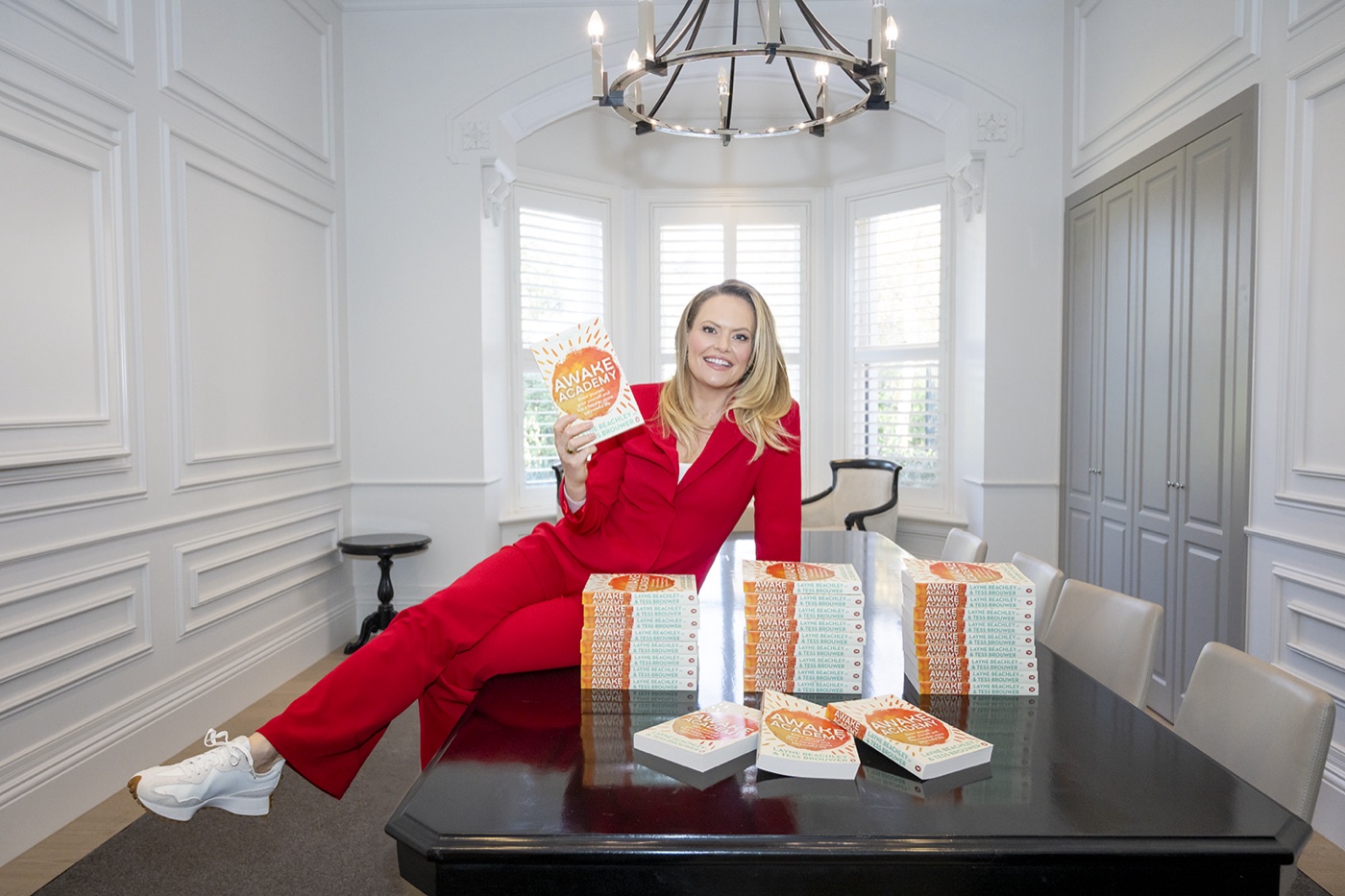 Tess Brouwer with the Awake Academy book